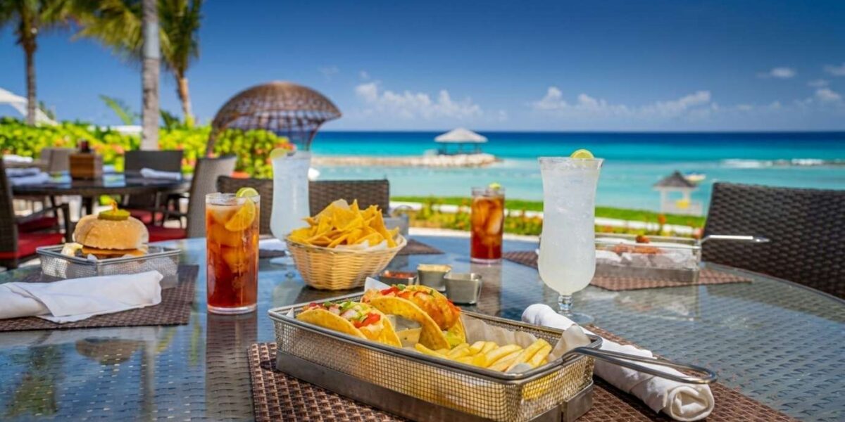Jewel Grande Montego Bay Resort oceanfront dining with gourmet cuisine, elegant restaurant, and Caribbean Sea views.